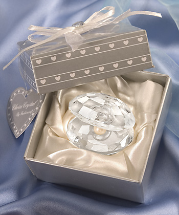 Each favor features a radiant half opened crystal oyster shell with a pearl